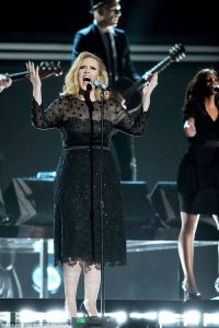 Adele invites couple on stage after he proposes in the audience
