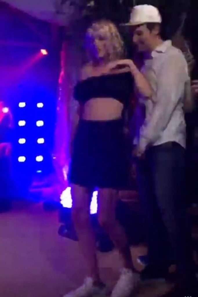 Taylor Swift Kisses and Dances Onstage With Fellow Partygoer After Surprise Performance With Nelly