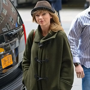 Taylor Swift Looks frumpy in duffel and hat combination