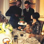 Kanye West cuts the cake for Kim Kardashian and North West