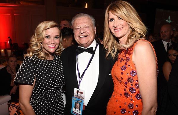 Reese Witherspoon in Michael Kors with Harold Matzner and Laura Dern in Matthew Williamson