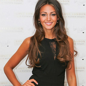 Michelle Keegan in sexy black jumpsuit with lacy peep-hole